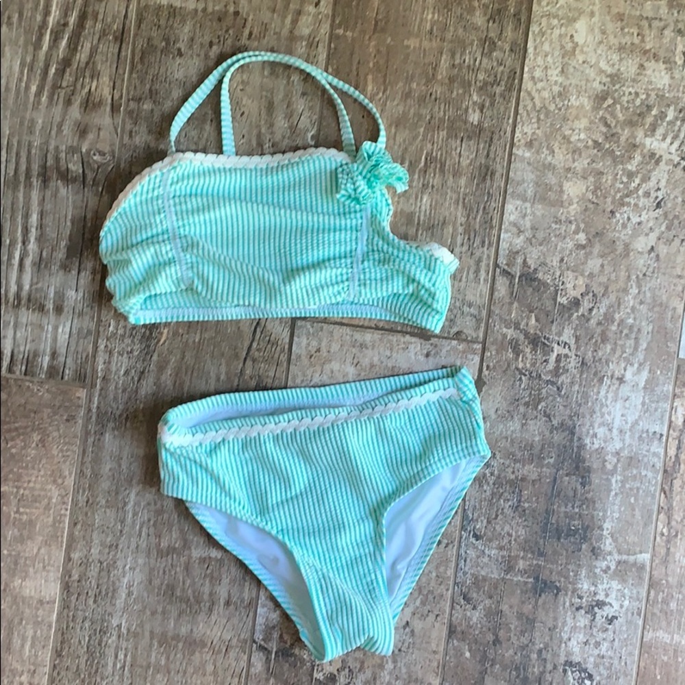 Like new (I don’t think she ever wore this) bikini